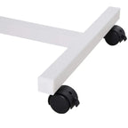 Over-bed table caster wheel with black locking housing on white frame
