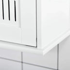 White cabinet door edge and handle area on a wall-mounted mirror cabinet, close-up