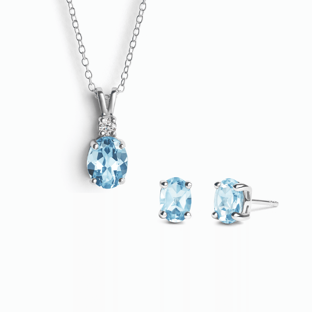 Sterling silver necklace pendant and stud earring set with blue topaz stones