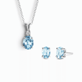Sterling silver necklace pendant and stud earring set with blue topaz stones