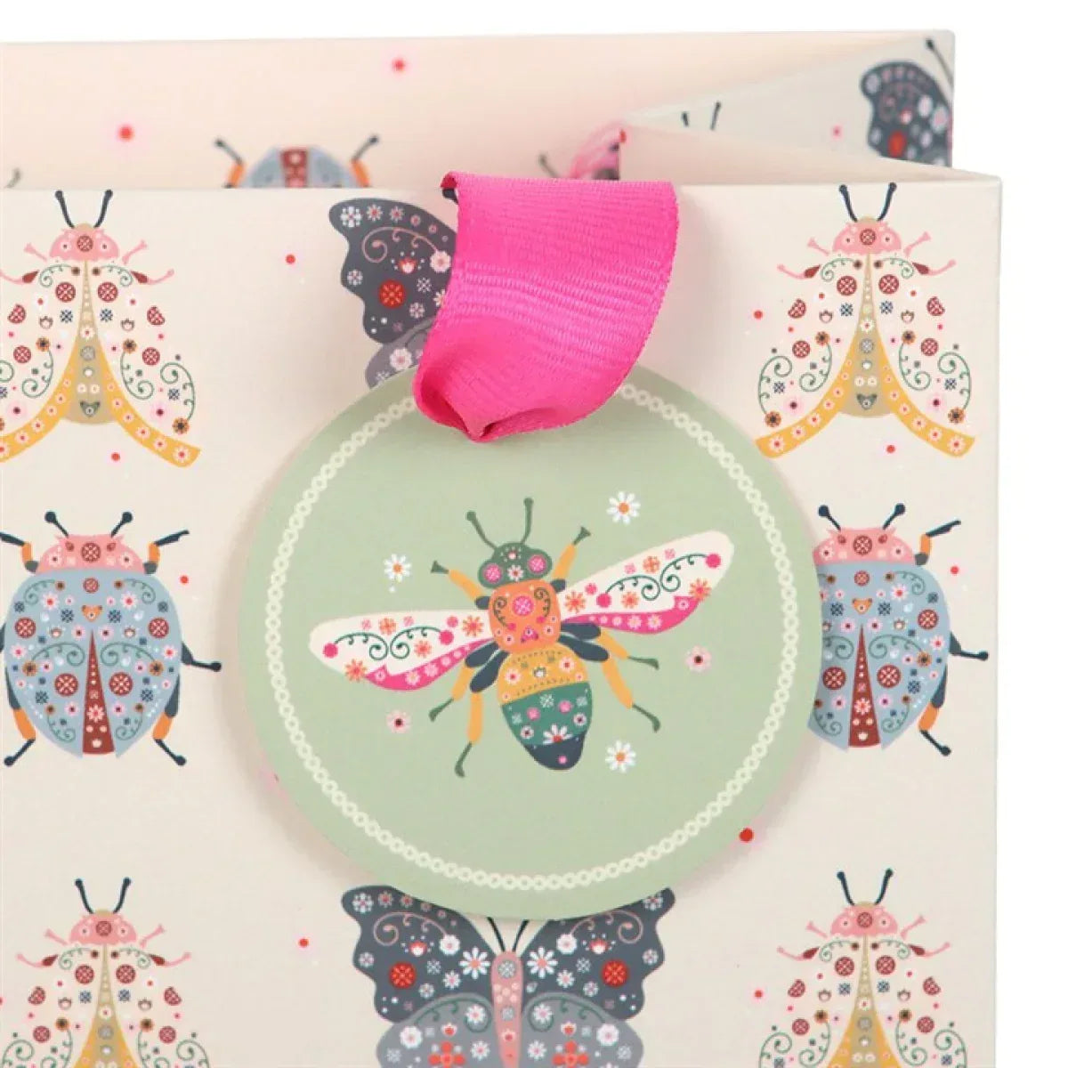 Medium gift bag detail with pink rope handle and circular floral bug artwork