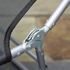 Powder-coated steel frame joint on black mesh sun lounger, close-up