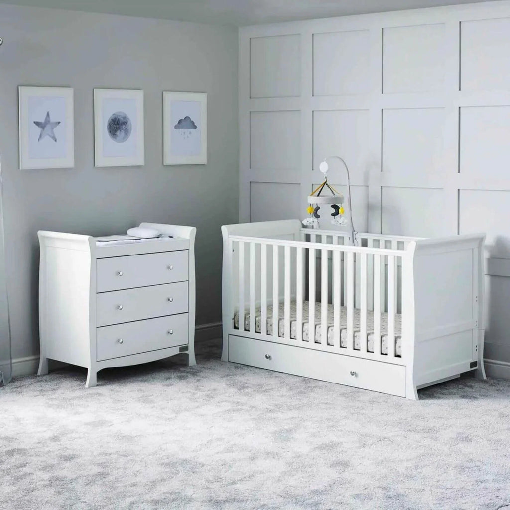 White baby cot with matching chest of drawers, vertical rail front