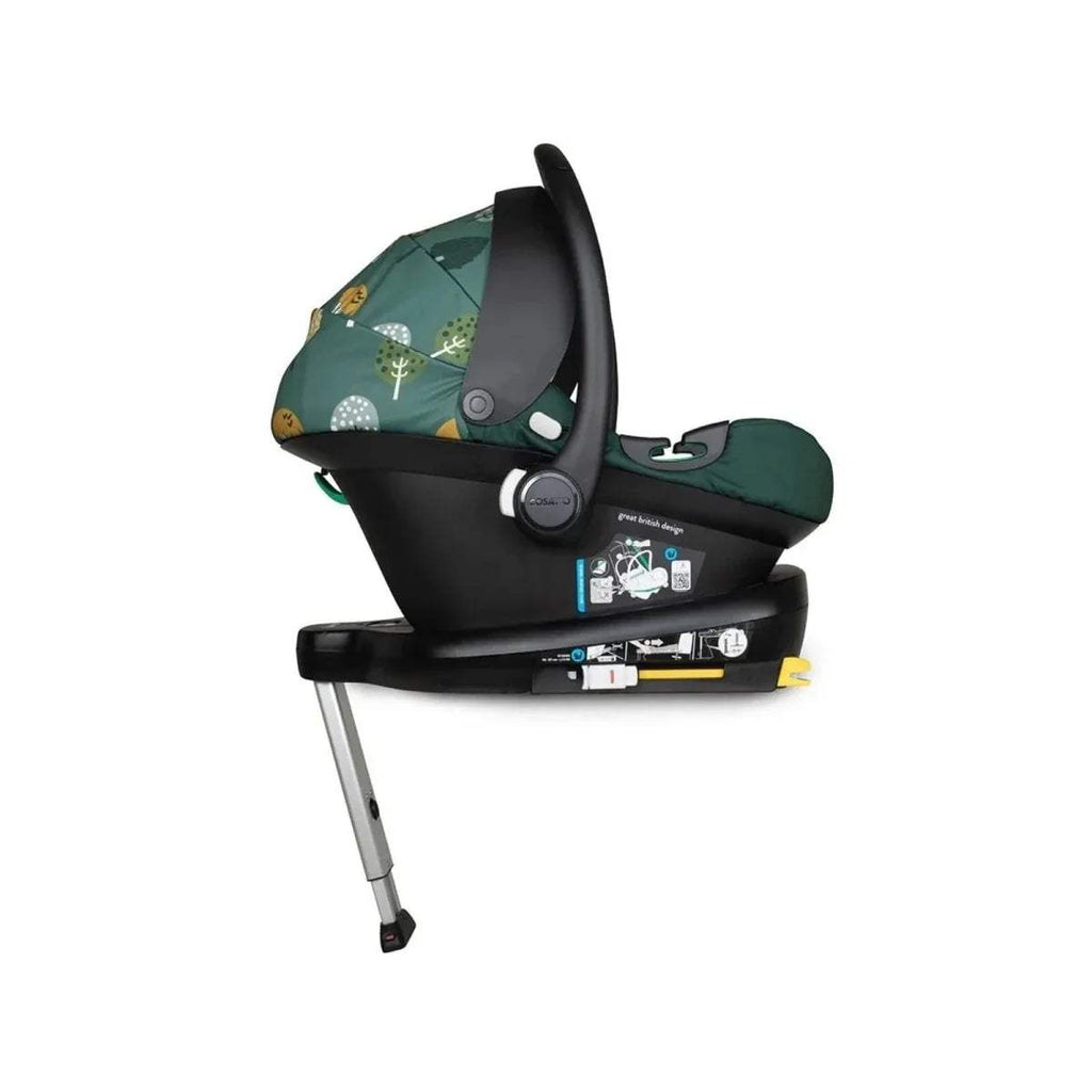 Green infant car seat with black base frame and side handle, angled view
