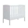 White space-saver cot frame with vertical slats, side panel and short legs