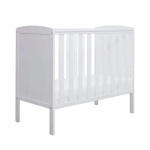 White space-saving cot with vertical slats and side panel