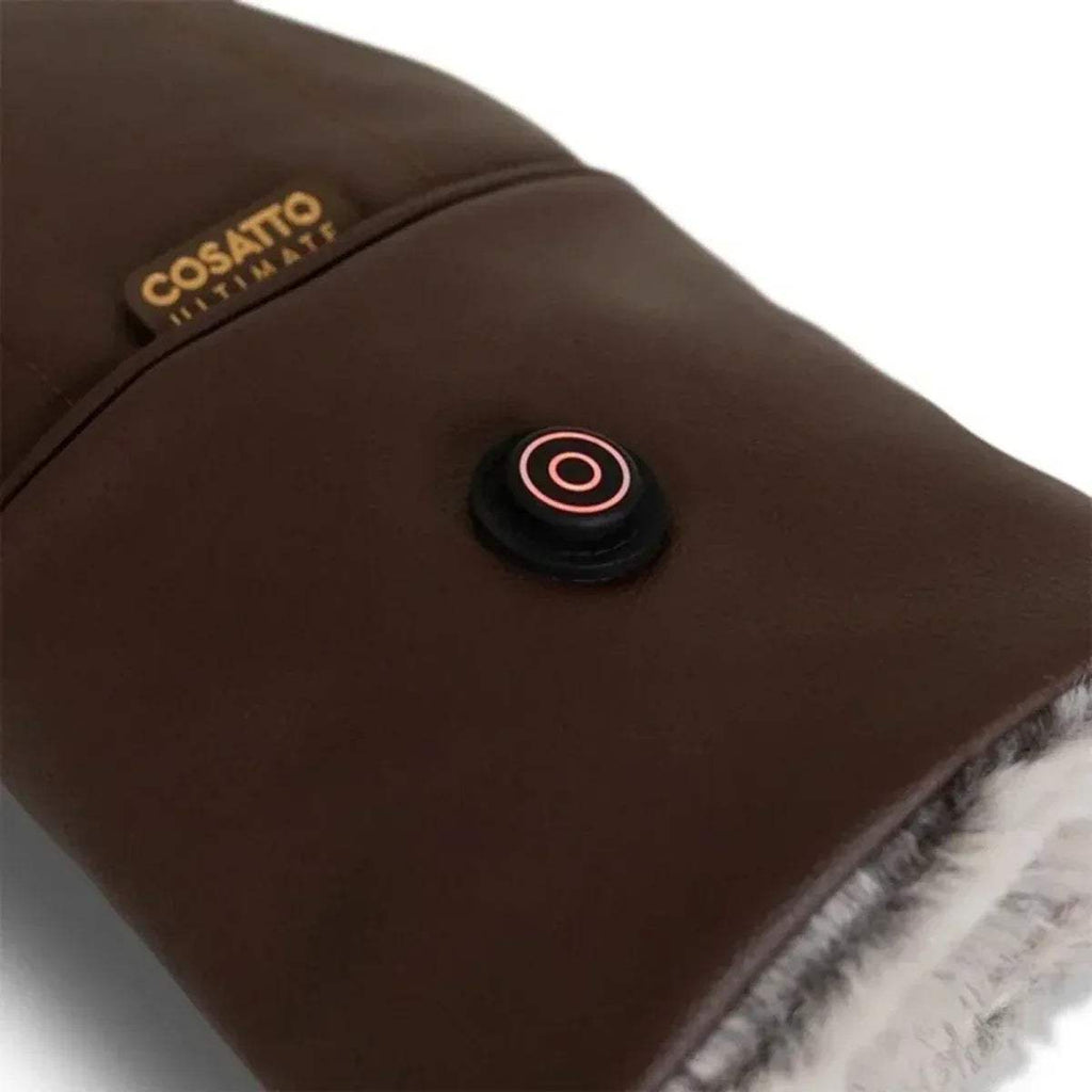 Brown heated snuggle mitt with circular power button and plush inner lining