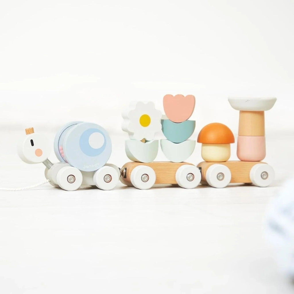 Wooden snail train toy with orange, pink, teal, and white rolling cars