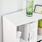White 6-cube bookshelf corner showing open cubbies and stored books