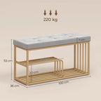 Grey upholstered shoe storage bench with tufted seat and gold steel frame, two shelves