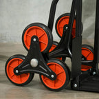 Close-up of stair hand truck wheels: black frame with orange-red wheel rims