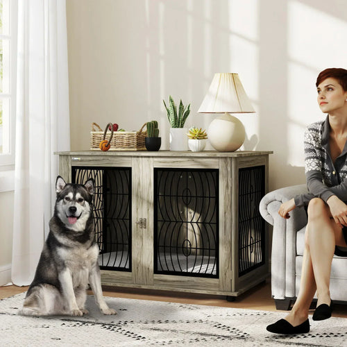 Grey dog crate furniture table with black wire doors and cushioned interior for indoor dogs