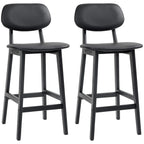 Set of two black bar stools with curved faux-leather seats and four-legged wooden frames