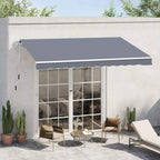 Grey retractable awning over patio doorway with scalloped front edge