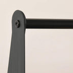 Black metal clothes rack corner leg cap and mounting hole detail