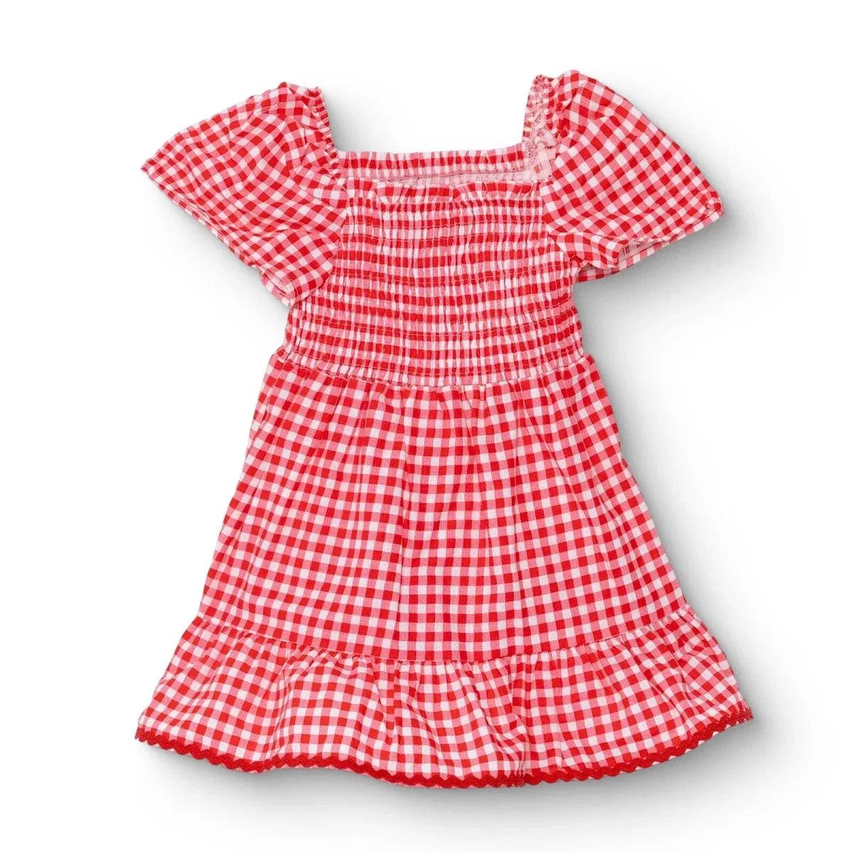 Pink gingham baby dress with shaped neckline, short puff sleeves, and tiered ruffle hem
