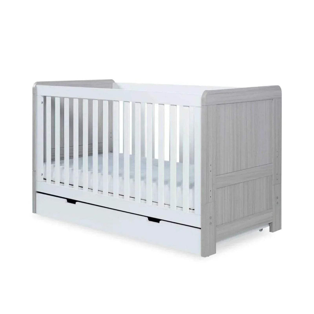 Ash grey and white baby cot with vertical slats and low drawer-style base