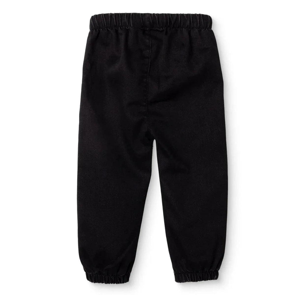 Black denim baby trousers with elastic waistband and cuffed ankles