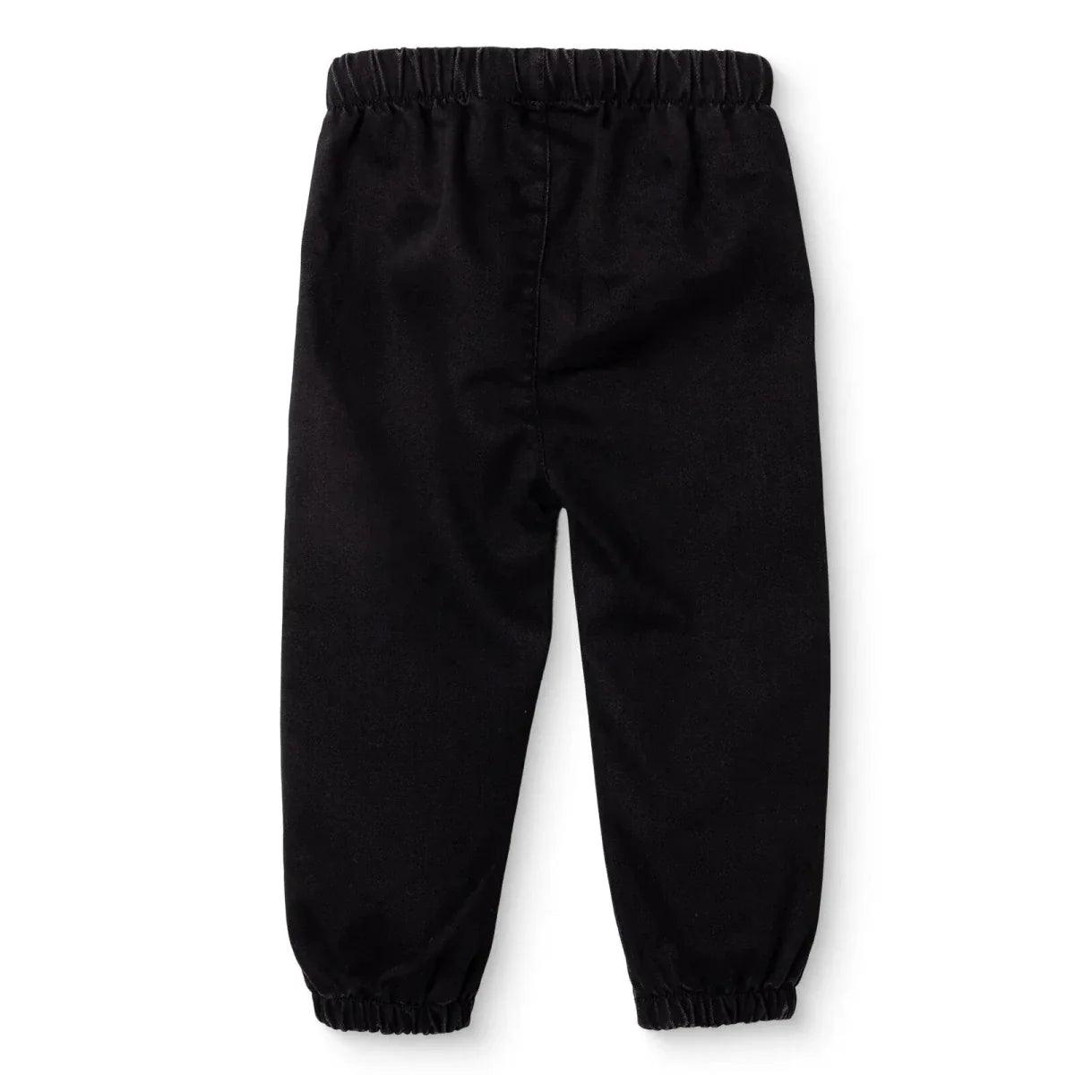 Black denim baby trousers with elastic waistband and cuffed ankles