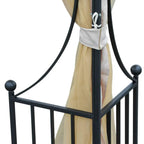 Beige sheer curtain corner panel on black metal gazebo frame with tie detail