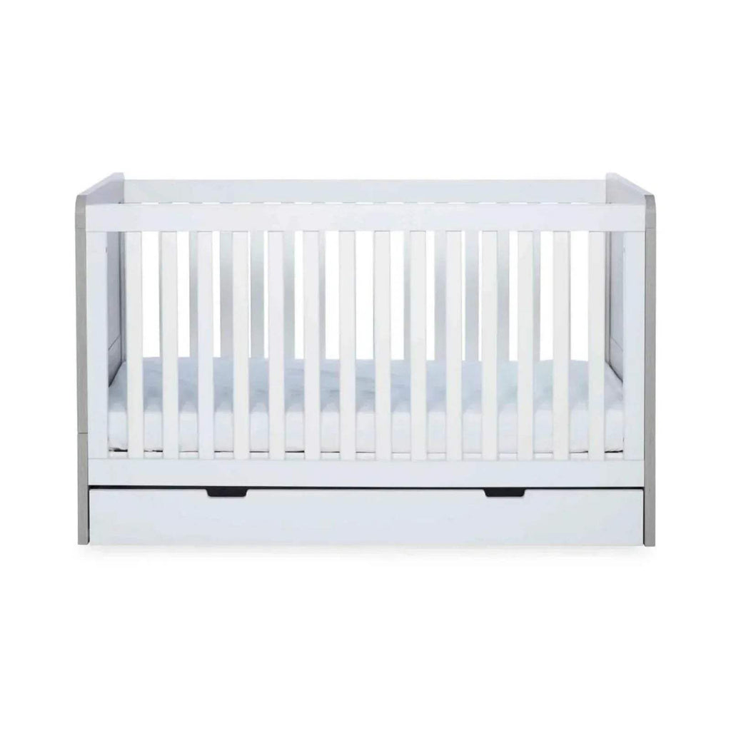 Front view of ash grey and white baby cot with vertical rail paneling