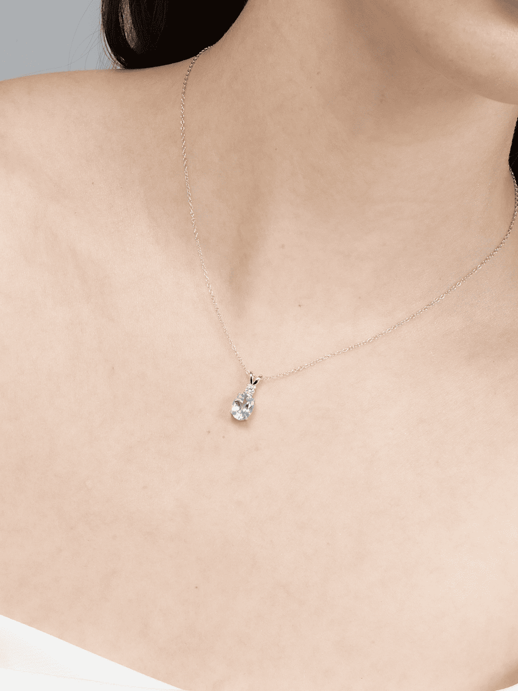 Sterling silver blue topaz teardrop pendant necklace close-up