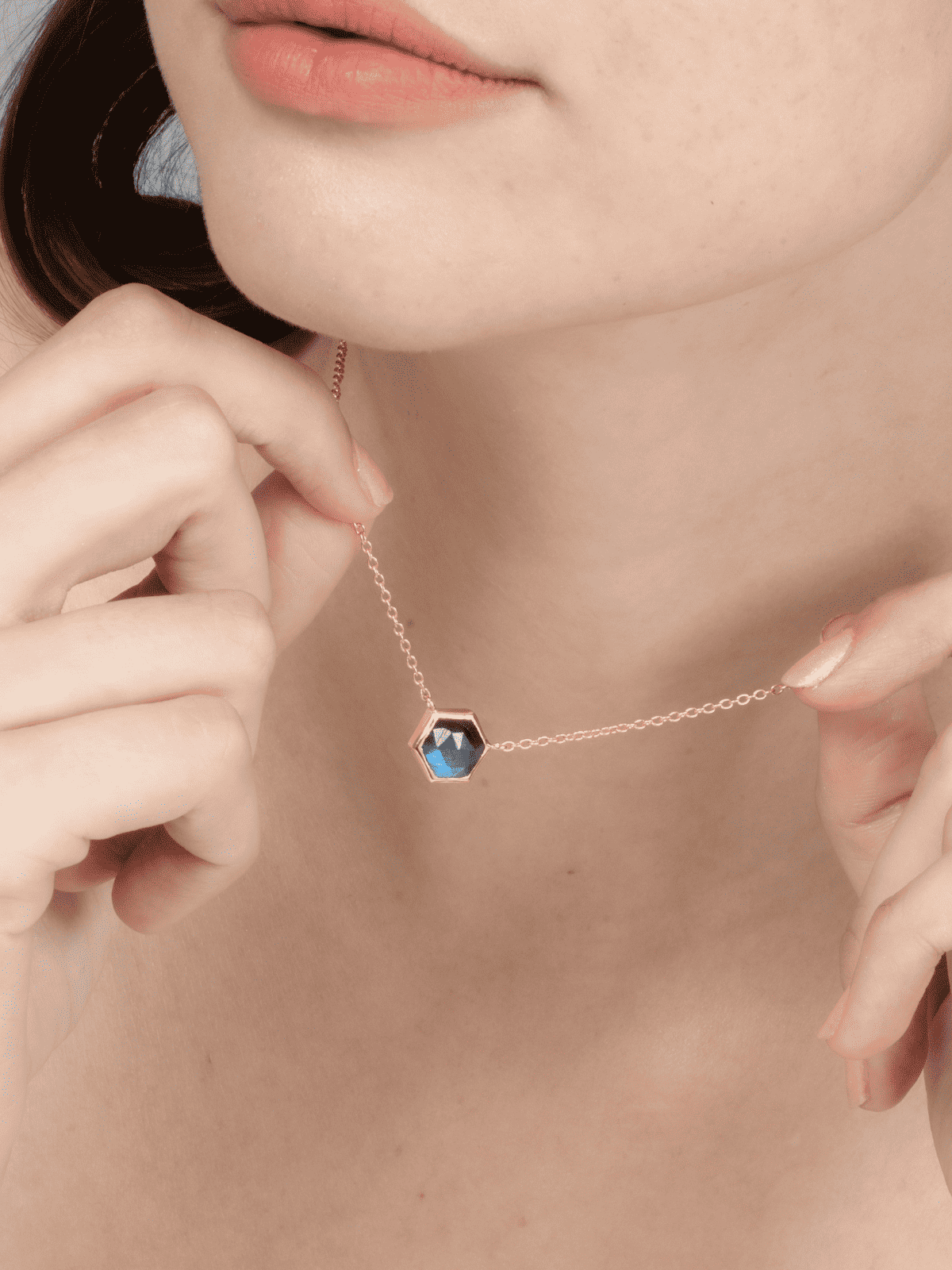 Labradorite pendant necklace with thin gold chain and faceted blue hex charm