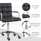 Black PU leather-look office chair with padded seat, chrome base, and wheels