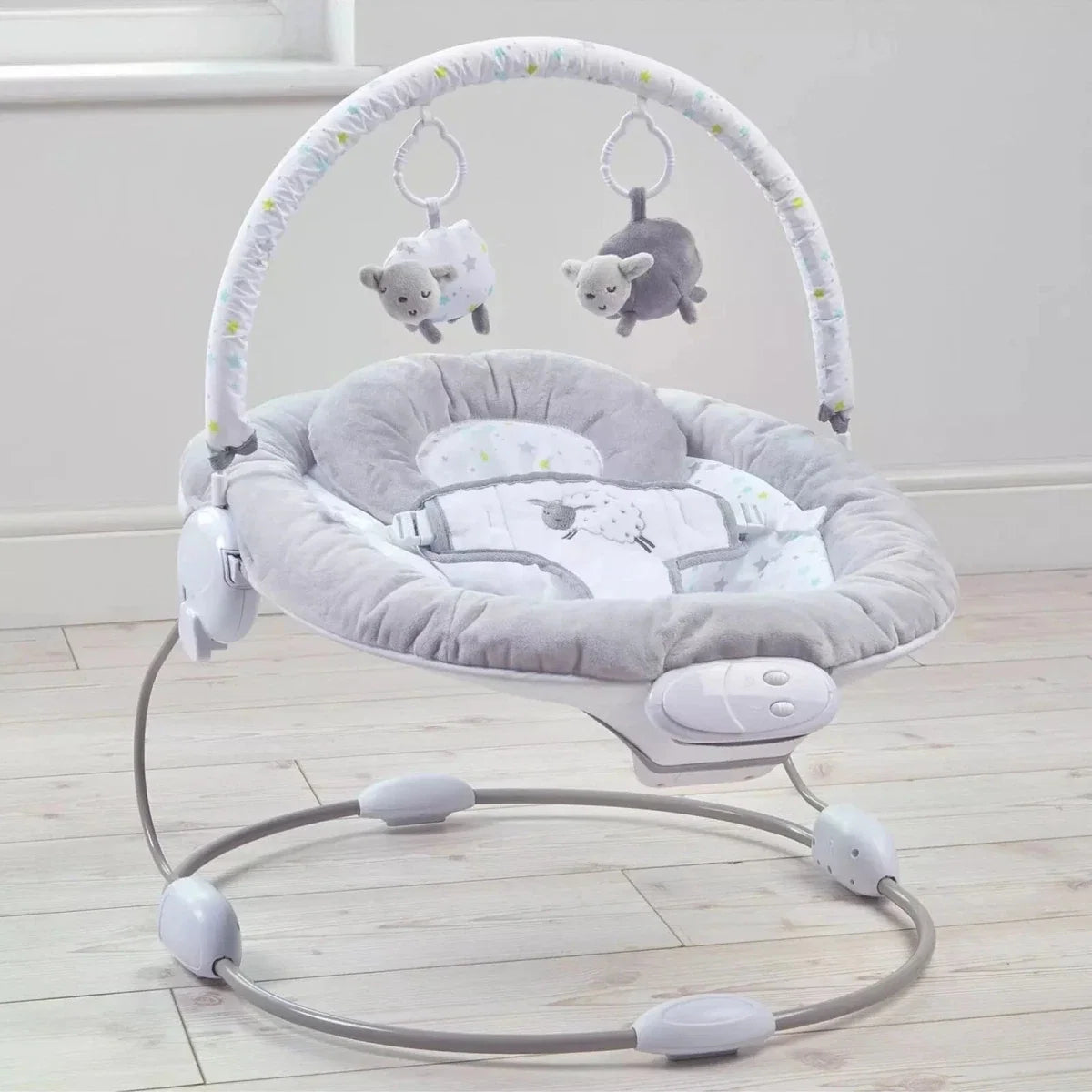 Grey baby bouncer with padded seat, arch toys, and oval rocking frame with control