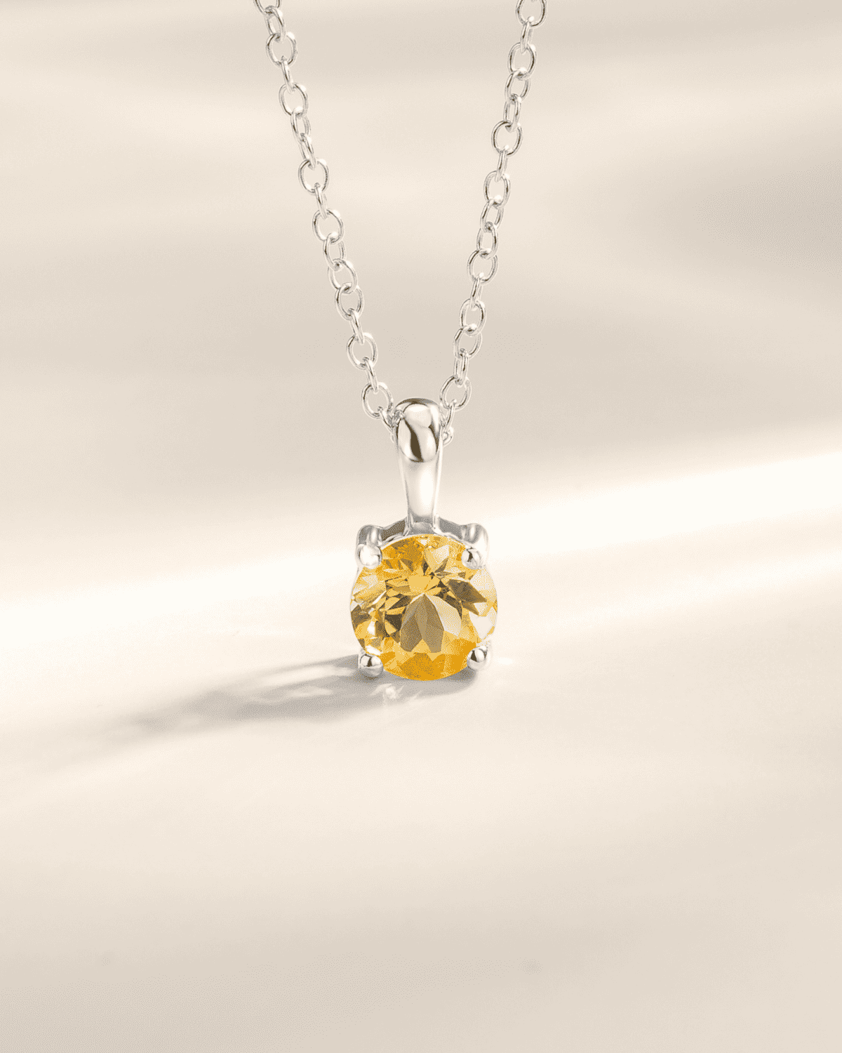 Sterling silver solitaire pendant necklace with round yellow citrine gemstone centerpiece