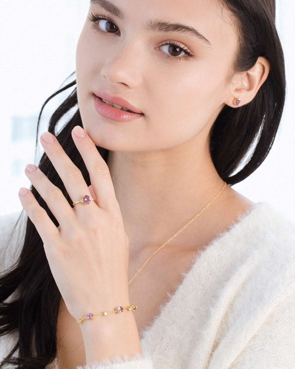 Amethyst pendant necklace with gold vermeil stud earrings and ring on model