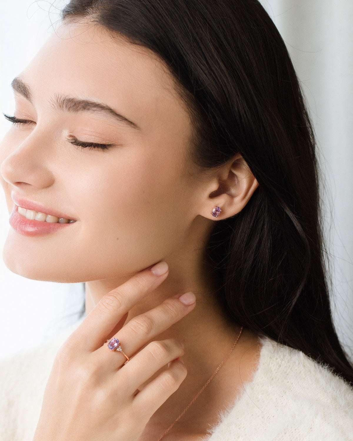 Amethyst stud earrings, ring, and delicate amethyst pendant necklace on model