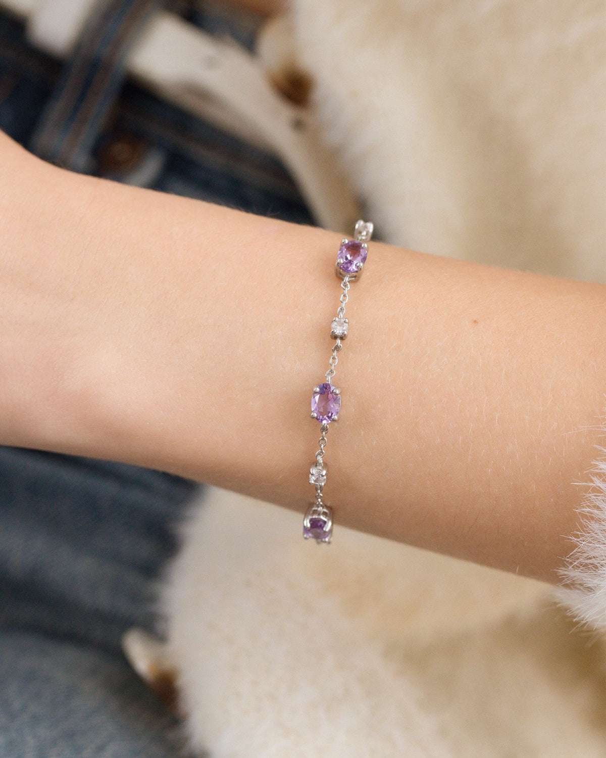 Sterling silver amethyst bracelet with three purple oval gemstone stations