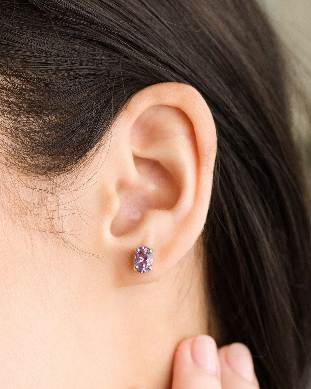 Sterling silver amethyst stud earring with faceted purple gemstone