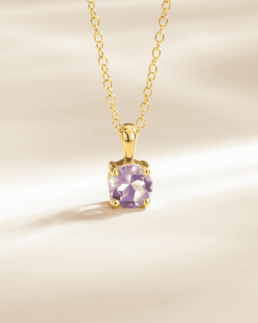 Gold vermeil solitaire pendant necklace with a lavender amethyst cushion-cut stone