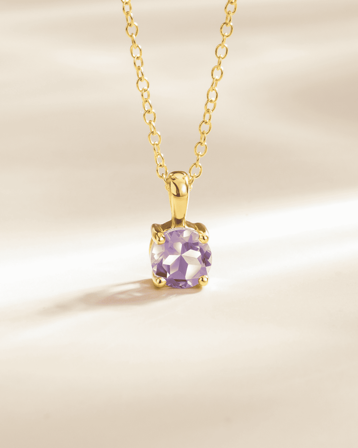 Gold vermeil solitaire pendant necklace with a lavender amethyst cushion-cut stone