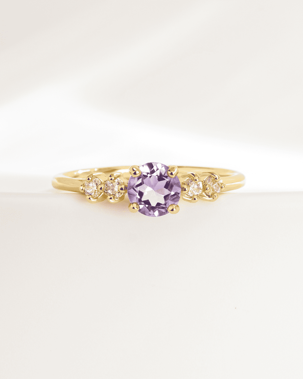 Gold vermeil five-stone ring with lavender oval center stone and four clear side stones