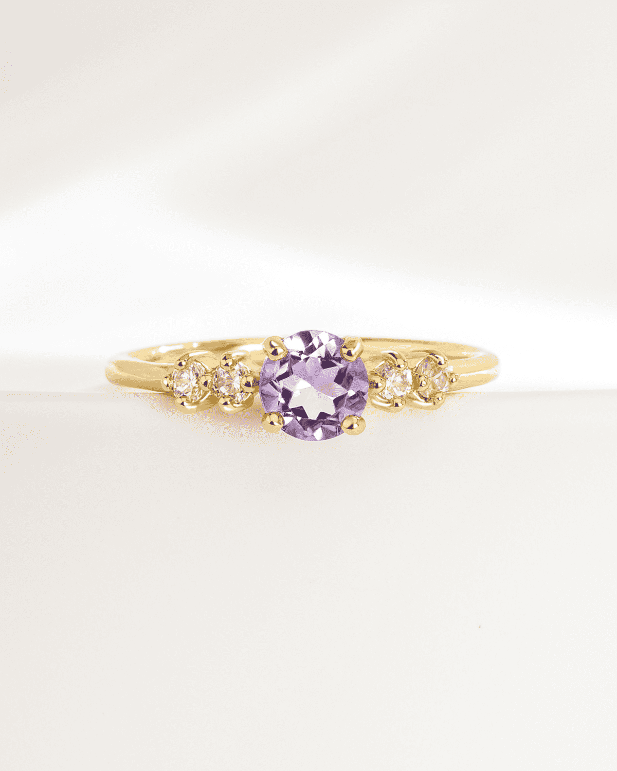 Gold vermeil five-stone ring with lavender oval center stone and four clear side stones