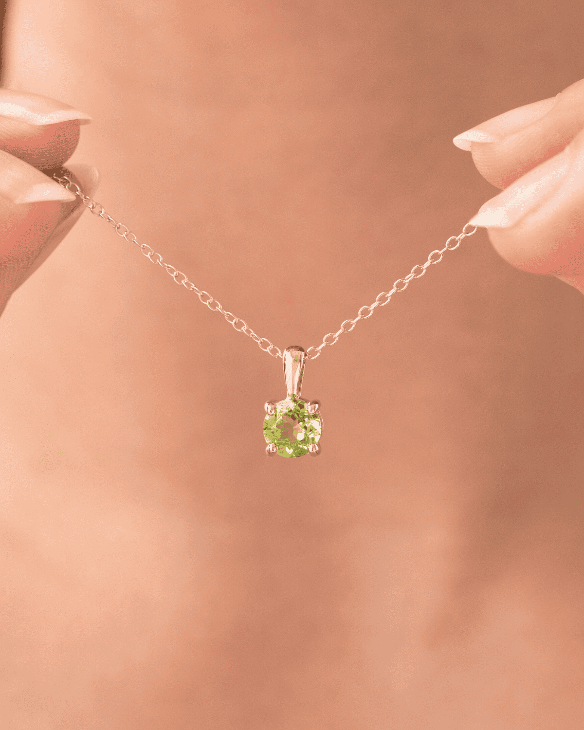 Sterling silver chain pendant necklace with small round peridot-green solitaire