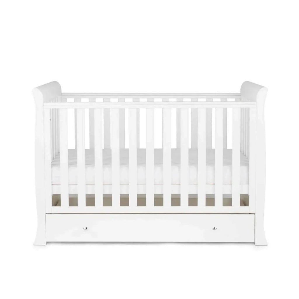 White mini cot bed with front drawer and vertical slats, viewed from straight-on angle