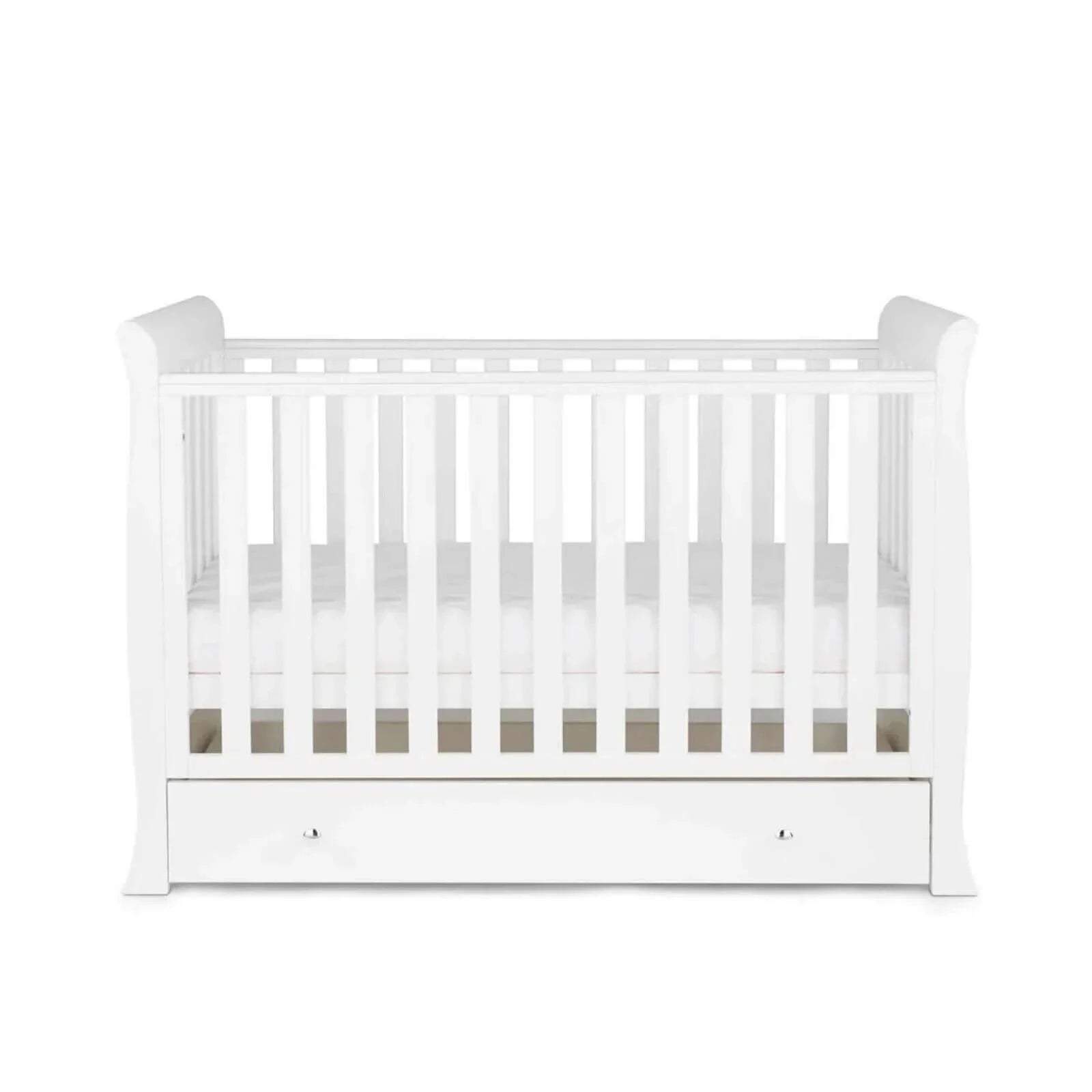 White mini cot bed with front drawer and vertical slats, viewed from straight-on angle