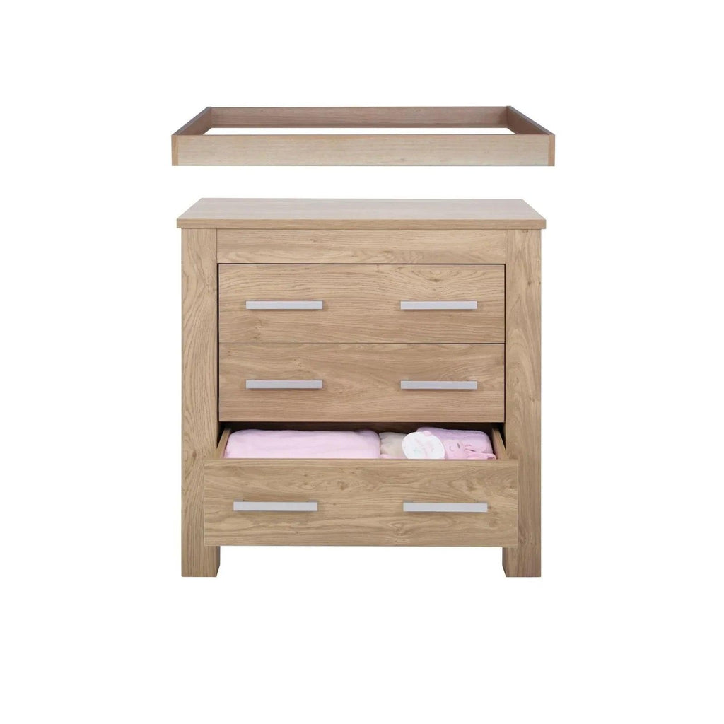 Oak baby dresser with open top shelf and three drawers, silver bar handles
