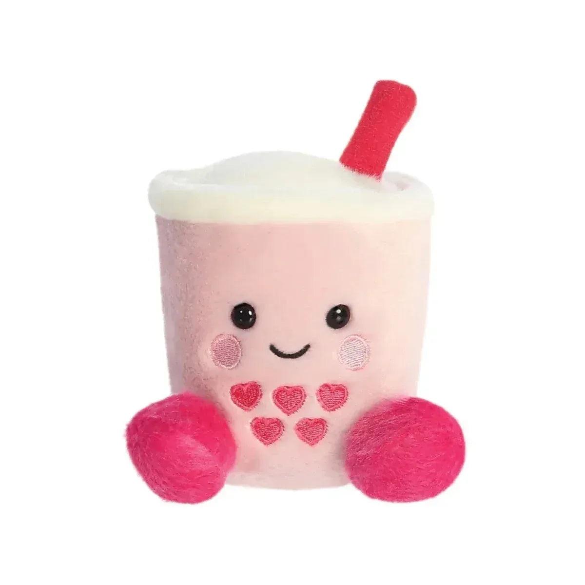 Pink and cream heart boba plush drink toy with red straw and fuzzy pink arms.