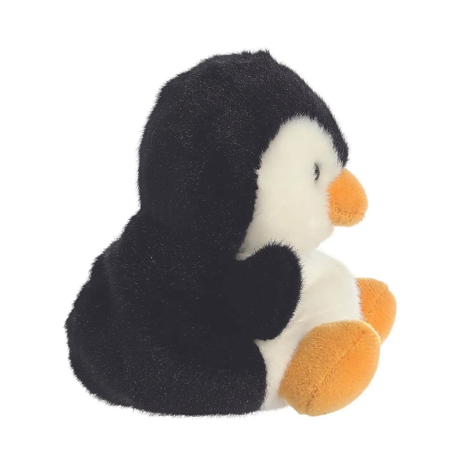 Side view of black and white penguin plush toy with orange beak, feet, and wing details.