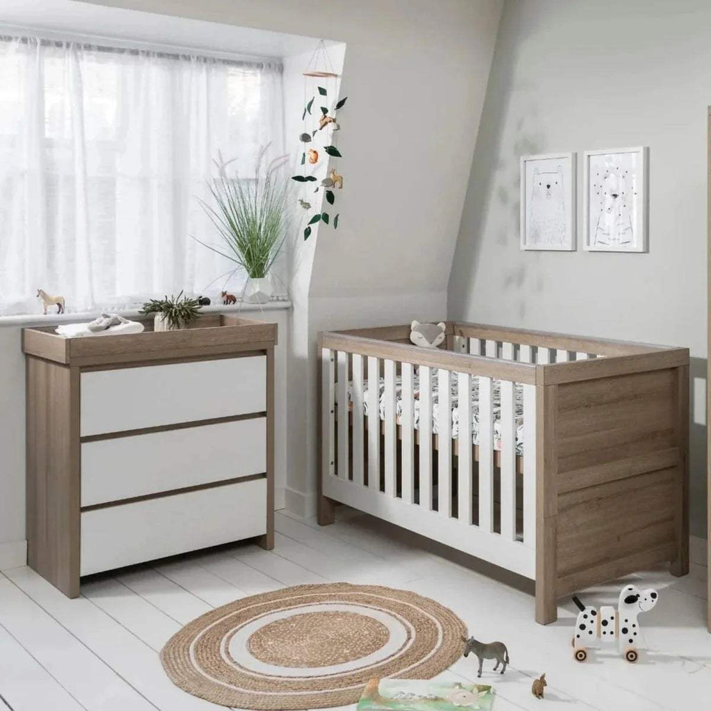 Oak daybed and matching changing table set with white slatted crib side