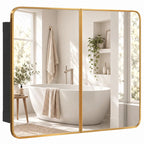 Gold-tone bathroom mirror cabinet with two hinged doors and rounded rectangular frame