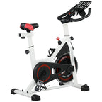 White and black stationary exercise bike with red seat and front stabilizers