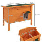 Orange wooden cat house with front opening and dark green roof mat, side view