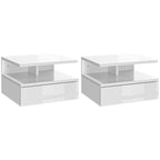Set of two white floating bedside tables with open shelves and drawers