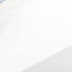 White cabinet drawer front with gold handle and smooth finish